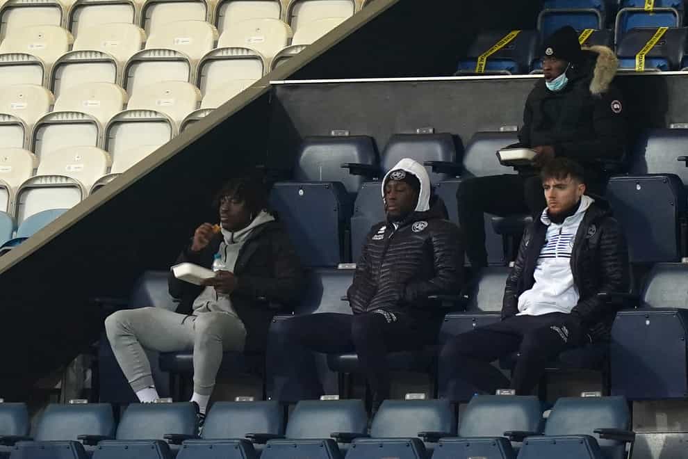Eberechi Eze, left, watches QPR from the stands