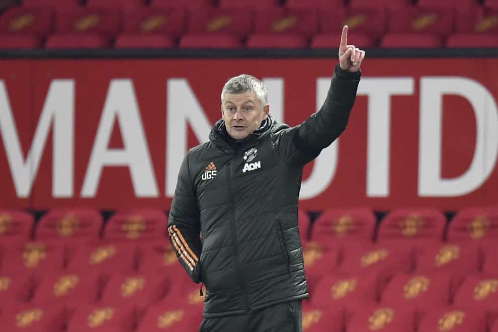 Manchester United manager Ole Gunnar Solskjaer points to the sky