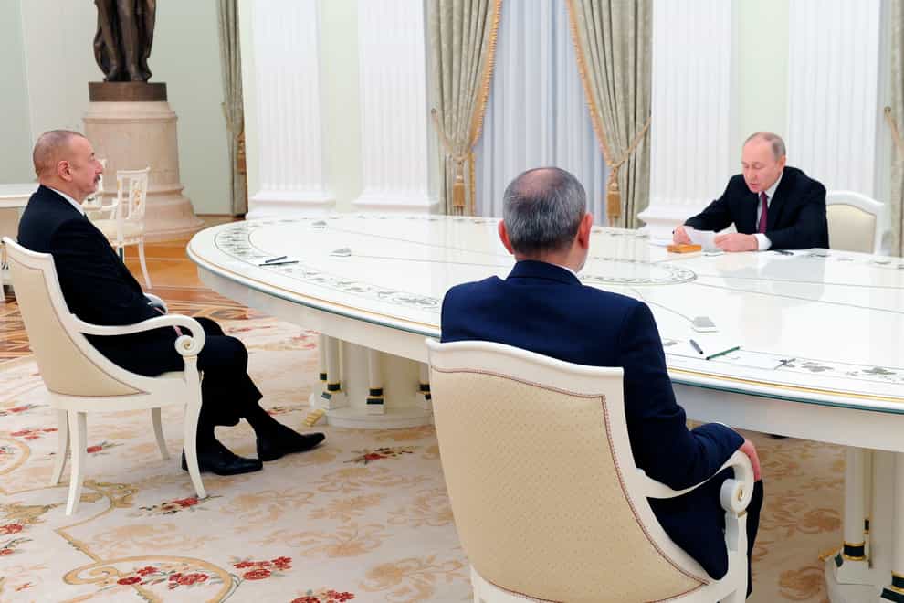 Russian President Vladimir Putin, right, speaks during his meeting with Azerbaijan’s president Ilham Aliyev, left, and Armenian prime minister Nikol Pashinyan in the Kremlin in Moscow (Mikhail Klimentyev/AP)
