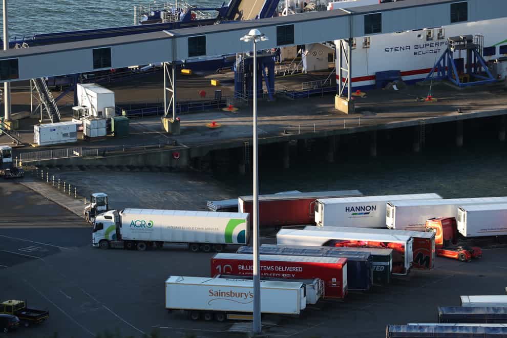 Heavy good vehicles are loaded onto a ferry