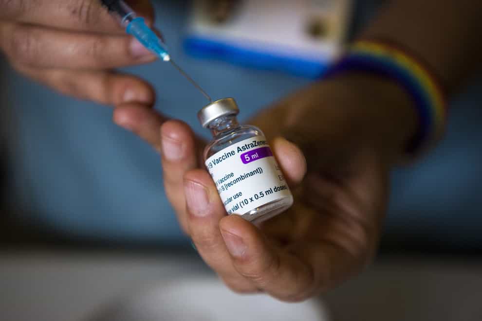 A doctor prepares to give the coronavirus vaccine