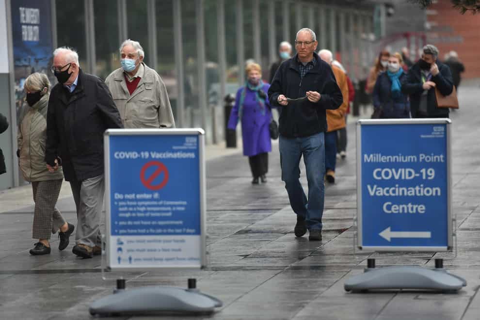People arrive at an NHS vaccination centre in Birmingham