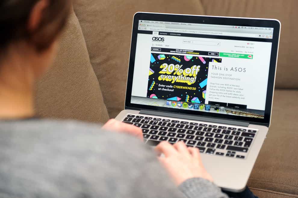 A woman looks at the Asos website