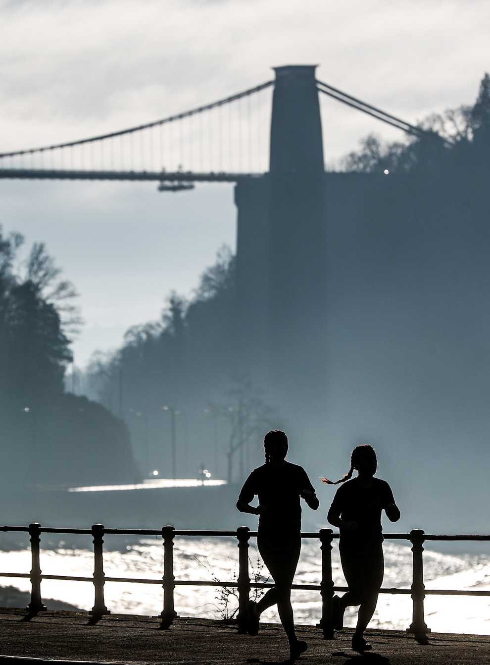 Joggers exercising along the River Avon in Bristol