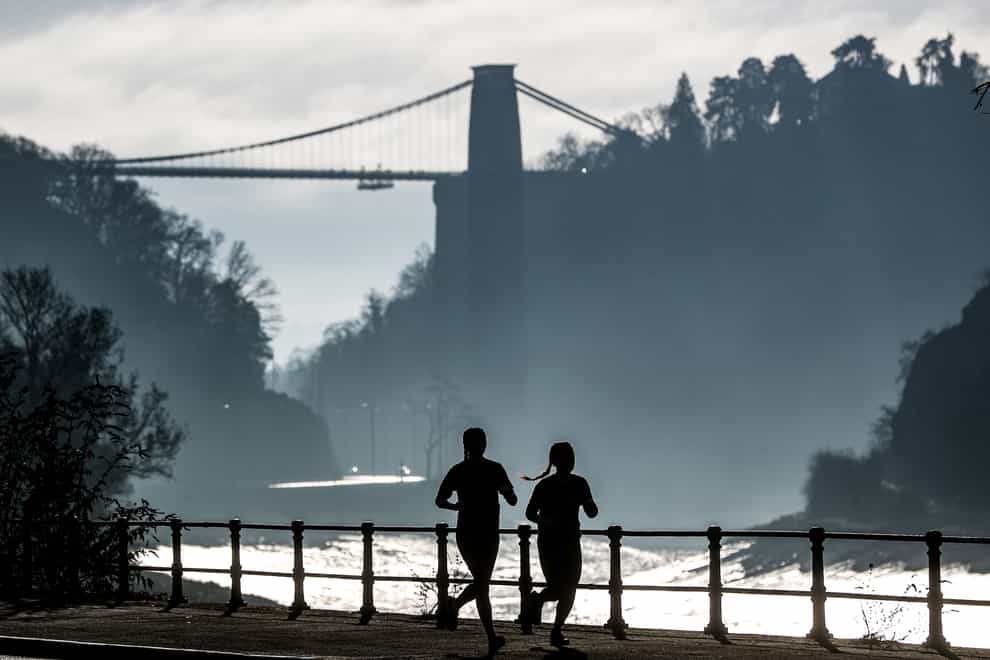 Joggers exercising along the River Avon in Bristol