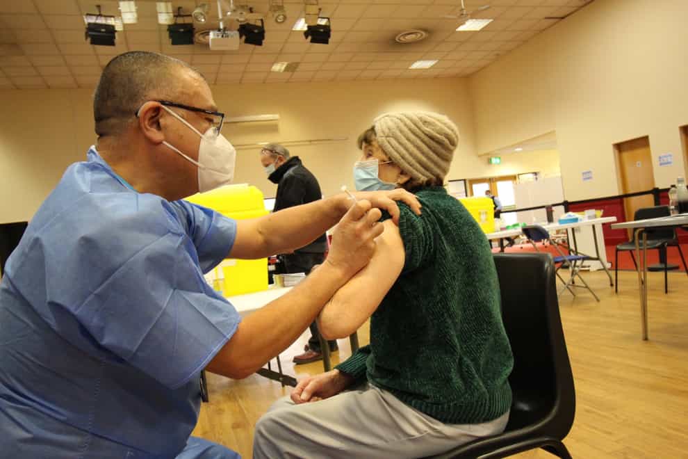 Jonathan Van-Tam vaccinates a woman