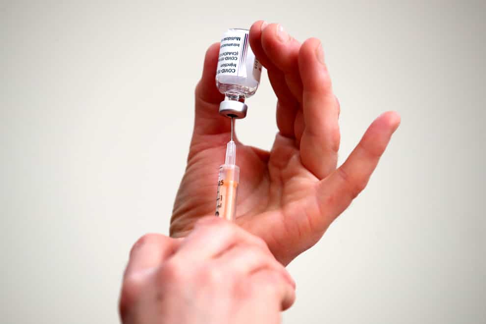 A syringe is filled with a dose of the Oxford/AstraZeneca coronavirus vaccine