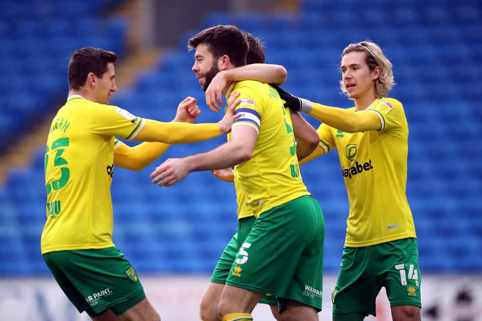 celebrates the opening goal for Norwich at Cardiff