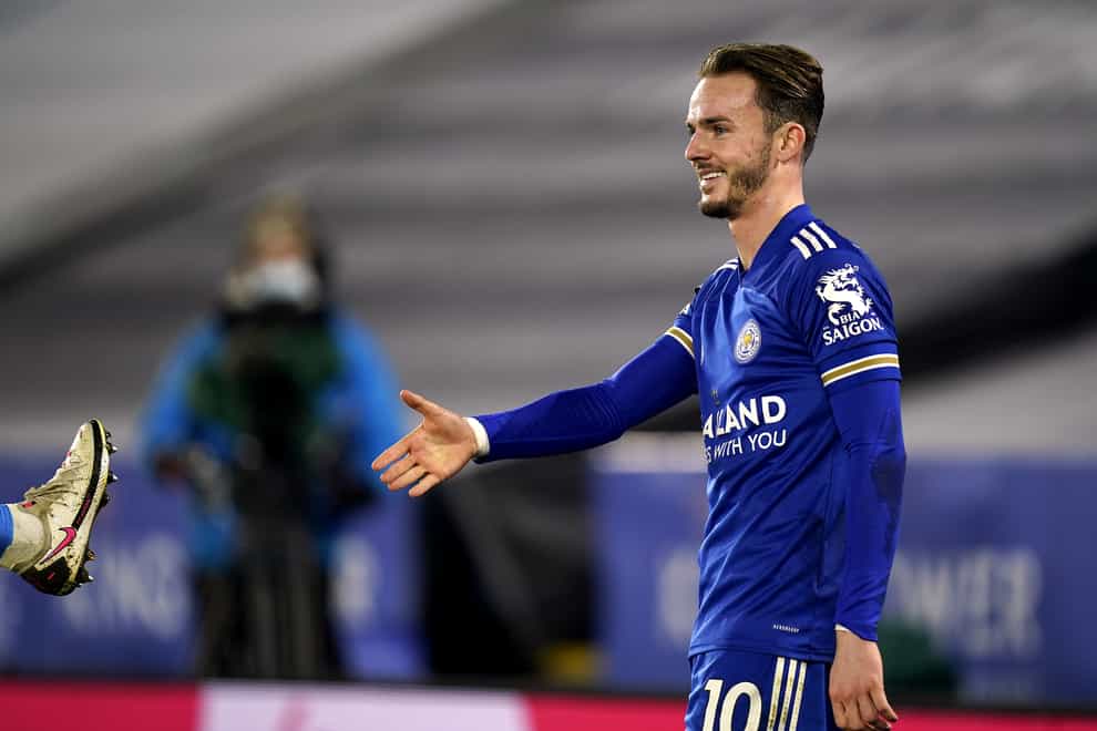 James Maddison mimes a handshake in a socially-distanced celebration of his goal