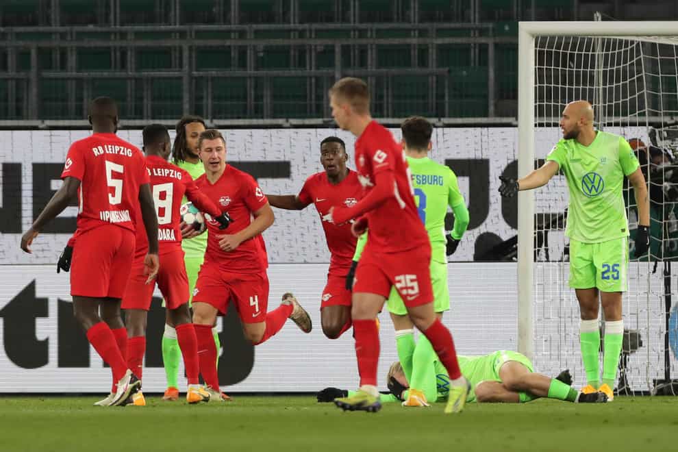Leipzig’s Willi Orban, third from left, celebrates with his team-mates after scoring