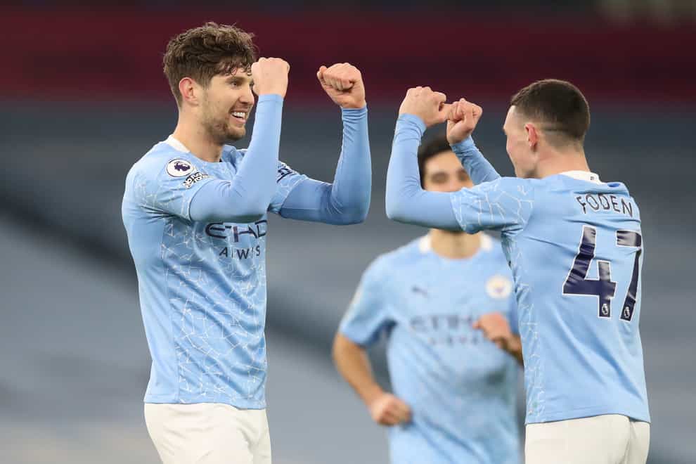 John Stones and Phil Foden celebrate