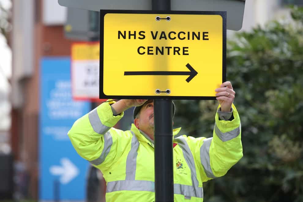 A direction sign to the NHS Covid Vaccine Centre at the Olympic Office Centre, Wembley, north London