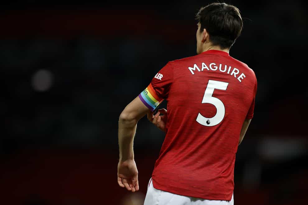Manchester United captain Harry Maguire adjusts his armband