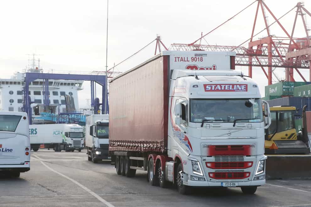 Freight trucks disembark a ferry at Dublin Port