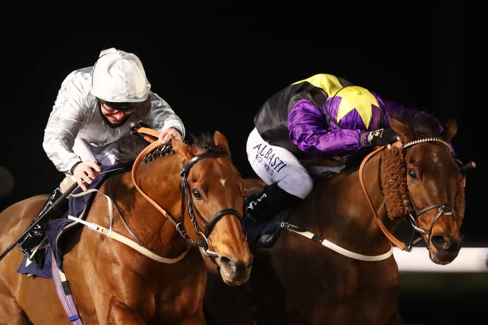Mildenberger and Joe Fanning (left) just get the better of Rainbow Dreamer to win the Betway Conditions Stakes at Wolverhampton