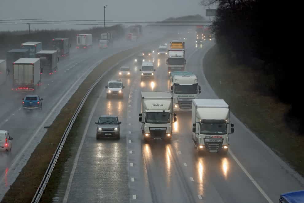 Traffic in heavy rain in West Yorkshire (Danny Lawson/PA)