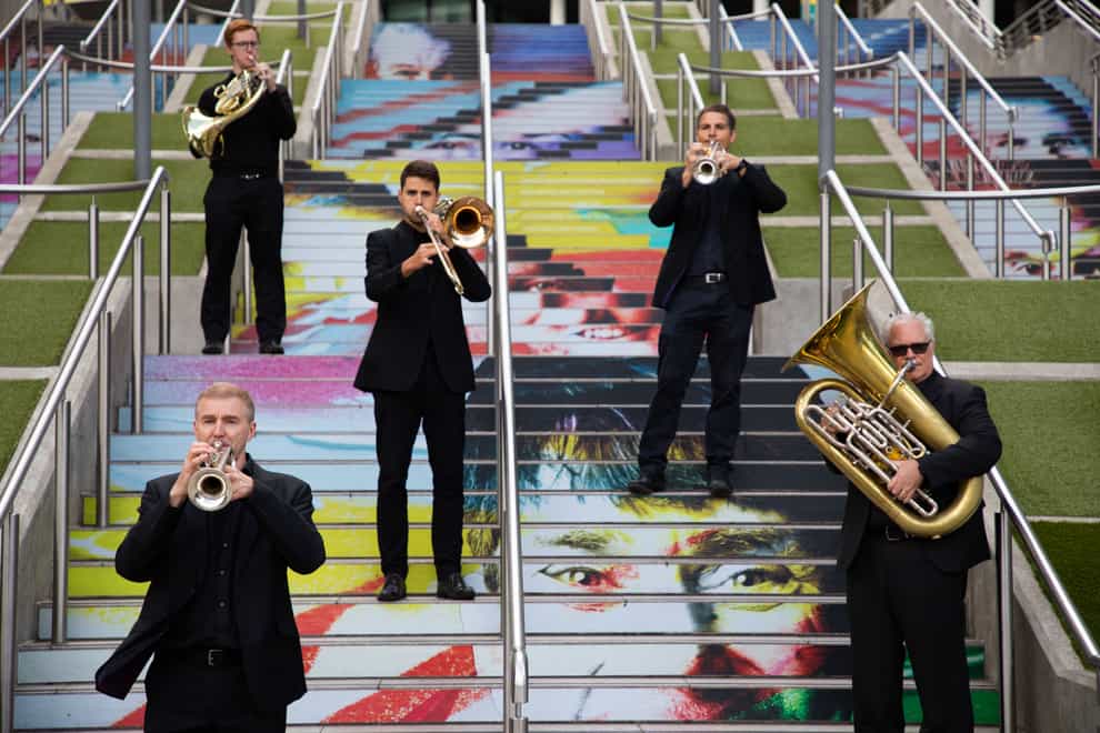 A brass quintet from the Royal Philharmonic Orchestra on the Spanish Steps in Wembley Park (David Parry/PA)