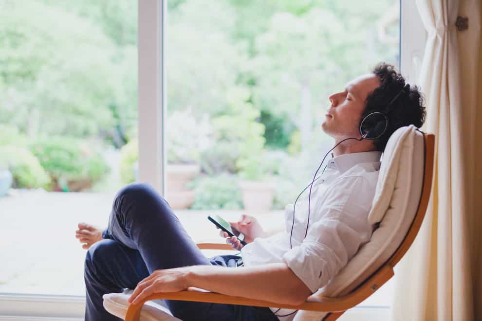 man listening to music after work