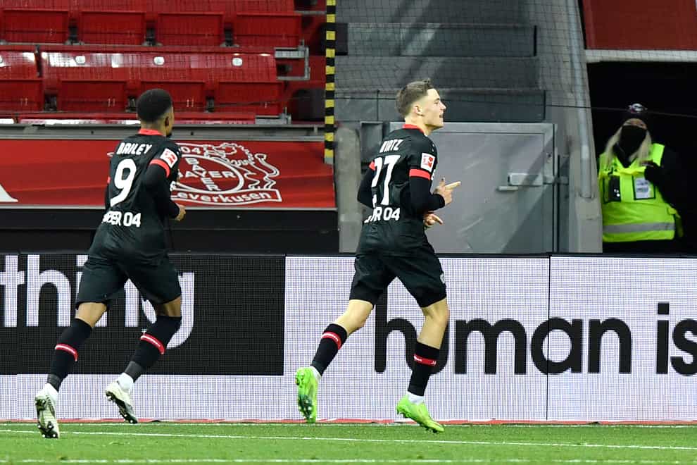 Florian Wirtz celebrates scoring the winner for Bayer Leverkusen
