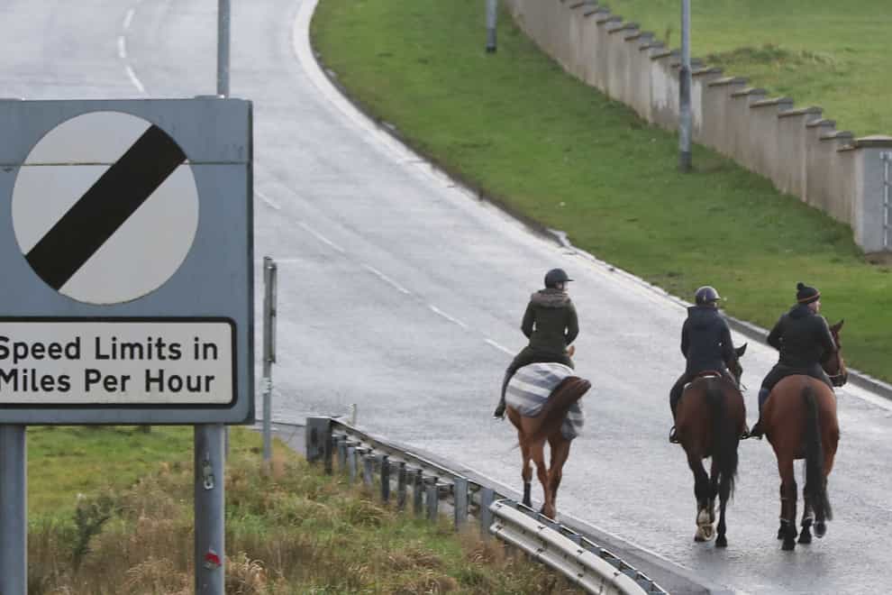 A group of horse riders crosses the border from the Republic of Ireland in Northern Ireland at Carrickcarnan in Co Louth (Niall Carson/PA)