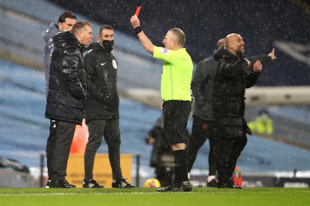 Dean Smith (left) was sent off by referee Jon Moss