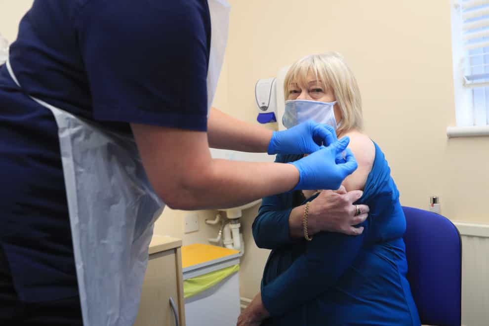 Elizabeth Van Tam, 79, the mother of Jonathan Van-Tam, deputy chief medical officer for England, is vaccinated against coronavirus