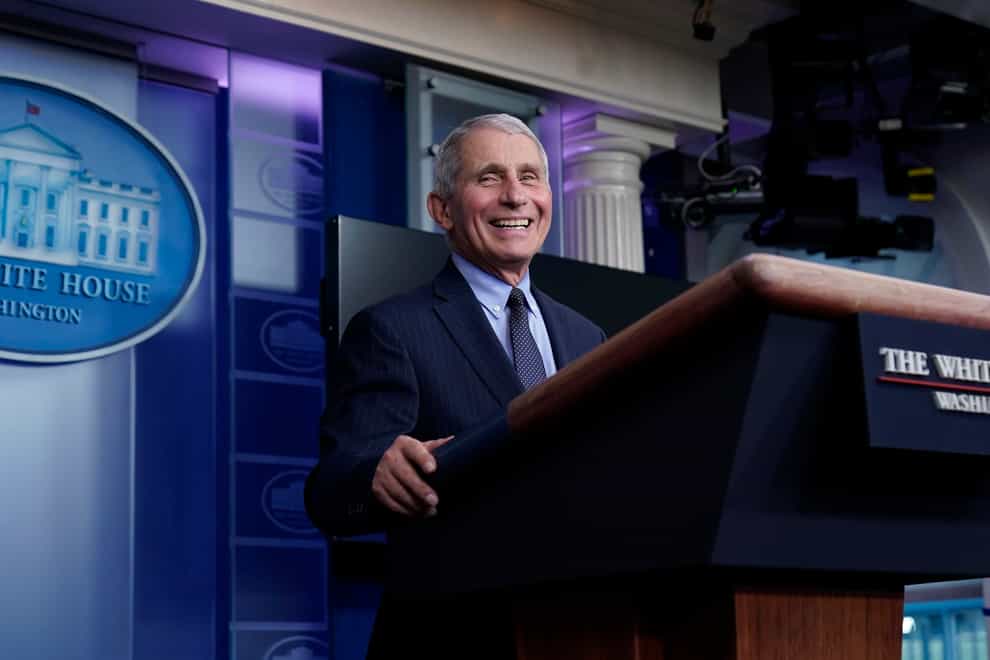 Dr Anthony Fauci laughs while speaking in the press room at the White House