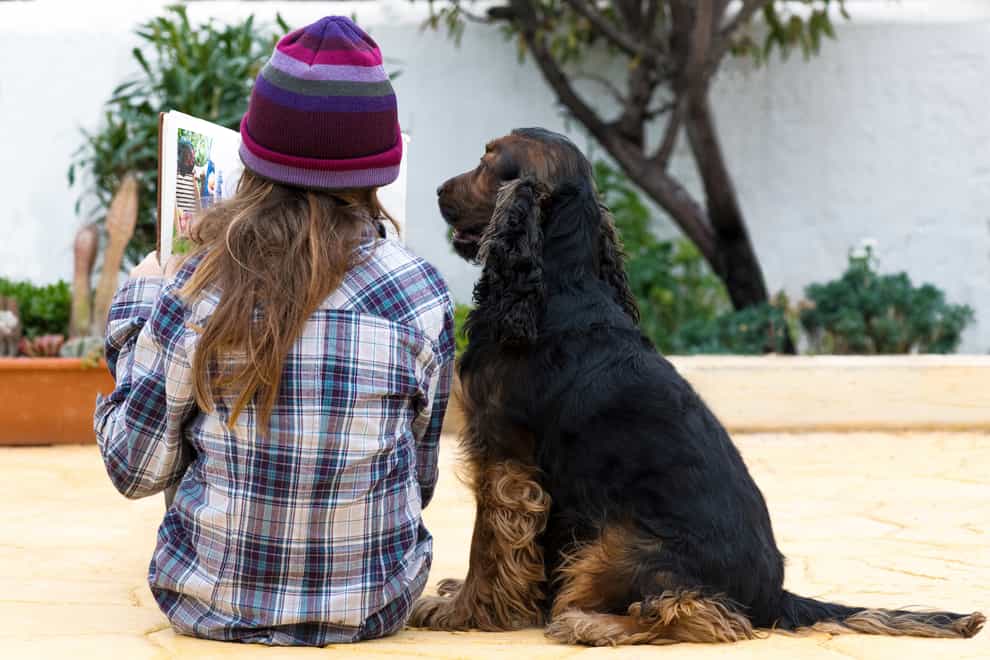 child reading to their dog