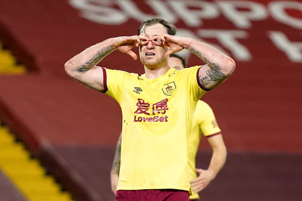 Burnley striker Ashley Barnes celebrates scoring at Anfield by circling his eyes with his fingers