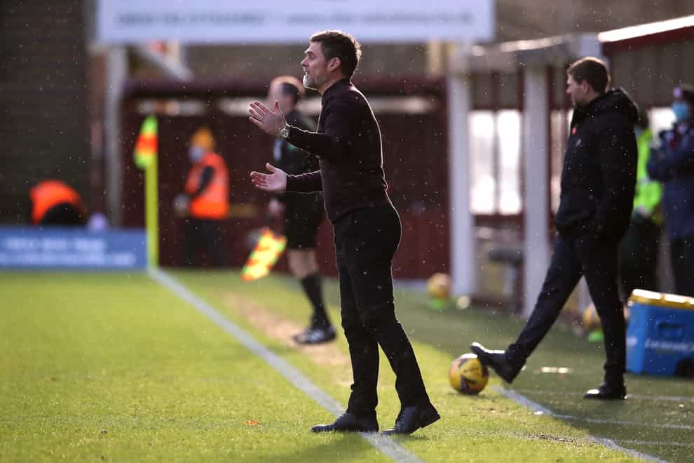 Motherwell manager Graham Alexander saw his side robbed of victory against Rangers because of a linesman's mistake