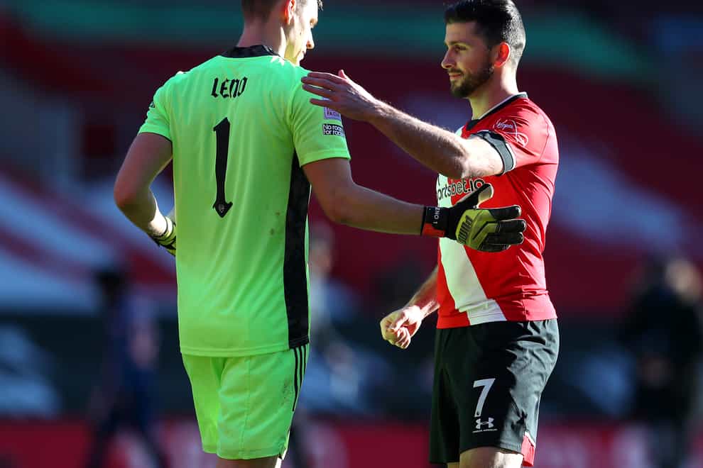 Arsenal goalkeeper Bernd Leno (left) and Southampton’s Shane Long after the final whistle