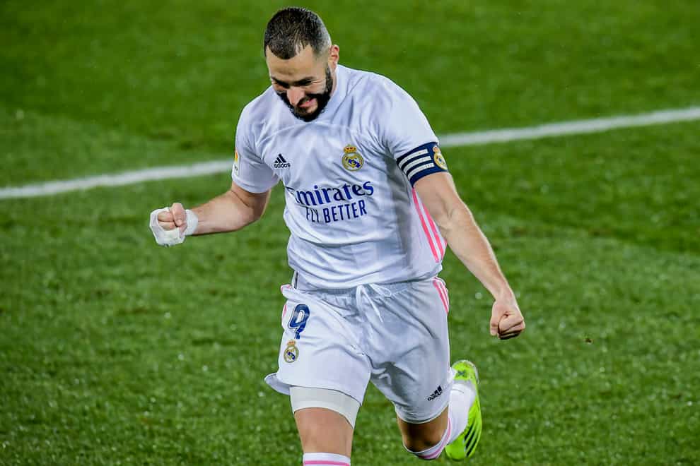 Karim Benzema celebrates after the first of his two goals