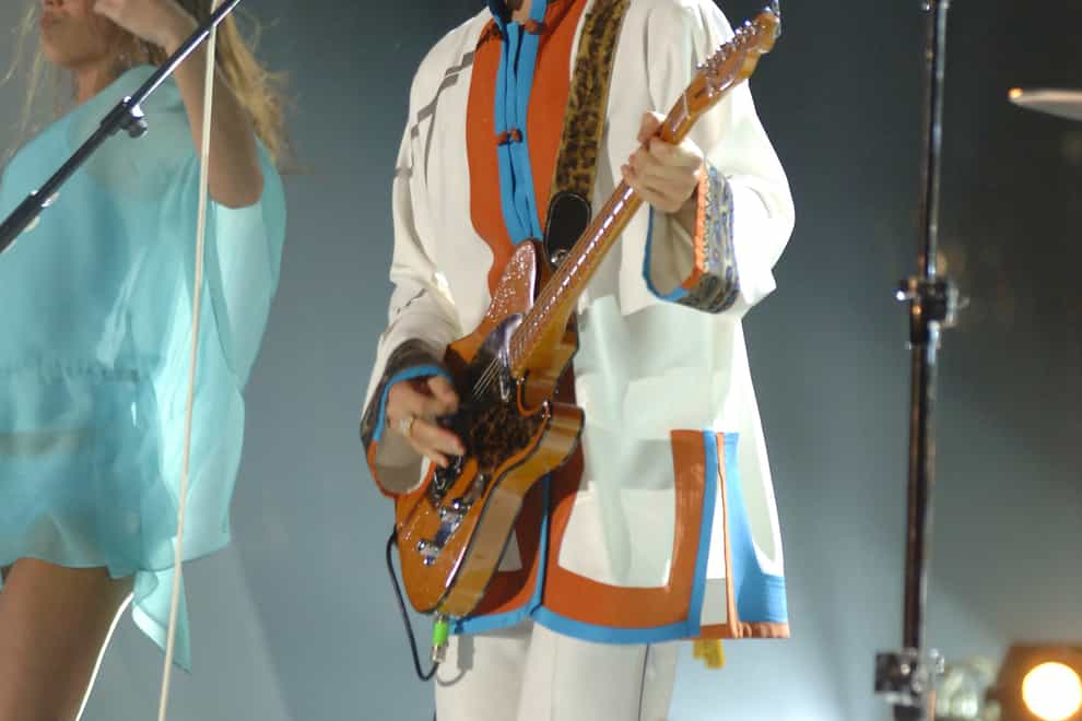 Prince performing on stage at the Brit Awards