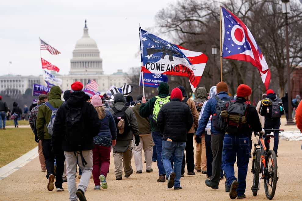 Supporters of former president Donald Trump marching towards the Capitol on January 6