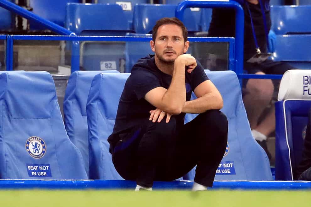 Frank Lampard sits down in front of the dugout
