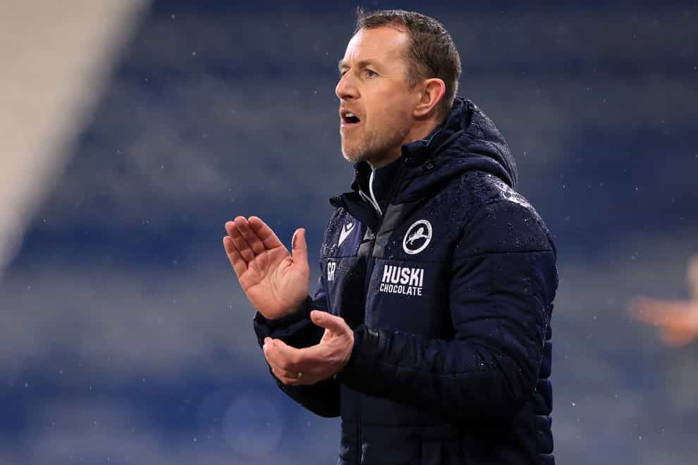 Millwall manager Gary Rowett claps on the touchline