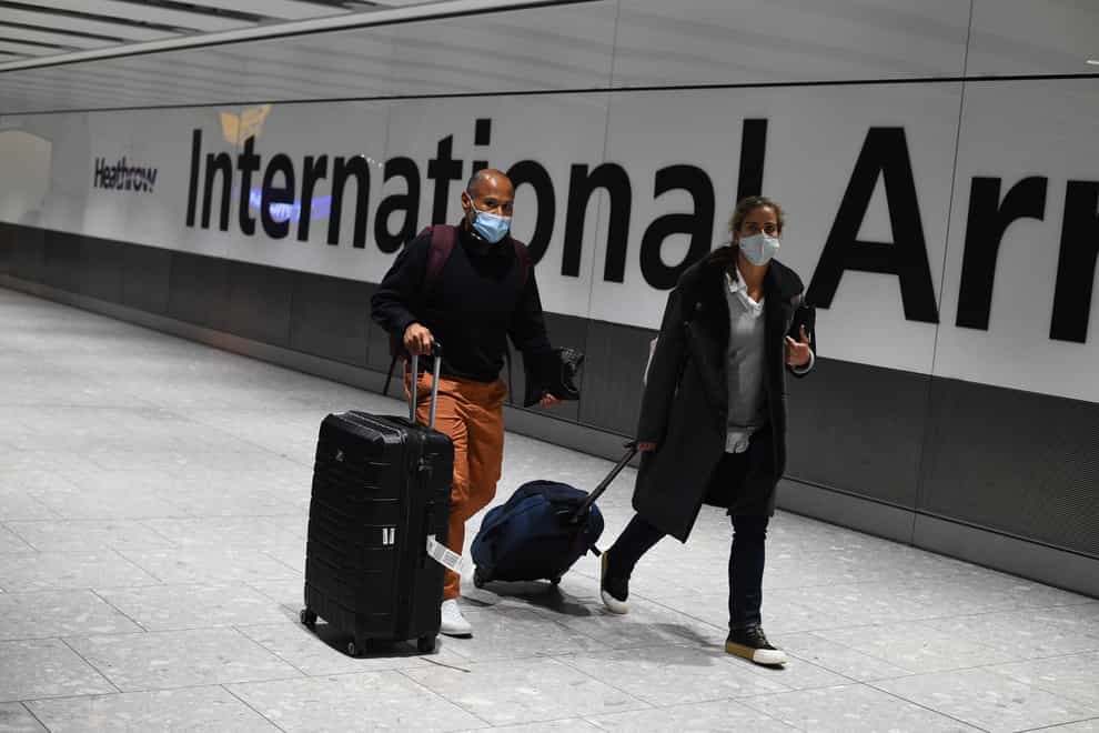 Travellers arrive at the airport