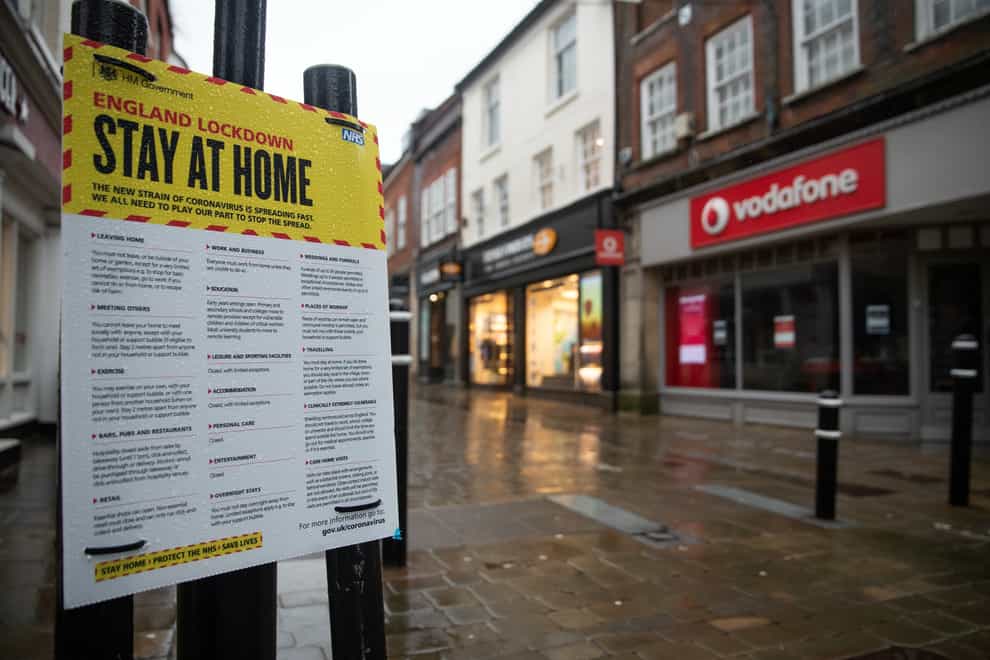 A 'Stay at home' coronavirus poster in an empty high street