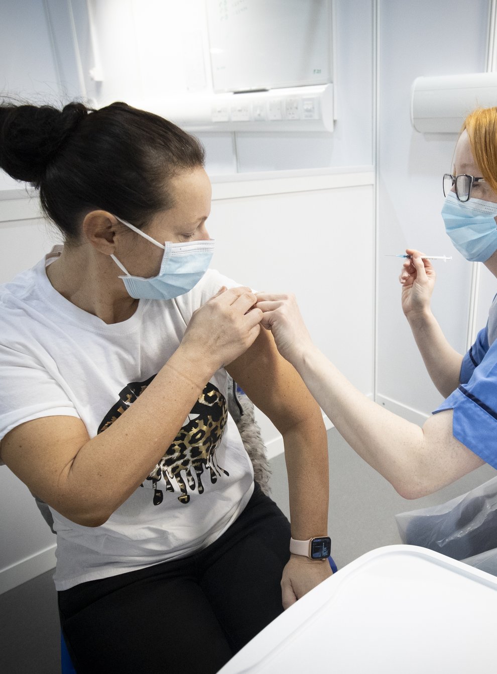 Nurse administers a coronavirus vaccine