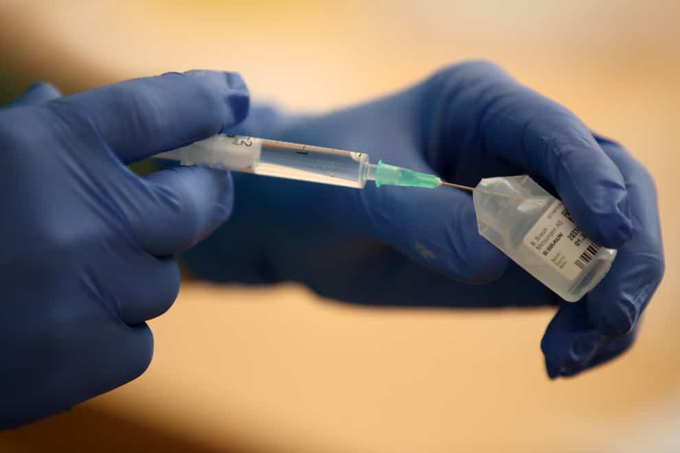 A nurse prepares a Covid-19 vaccine