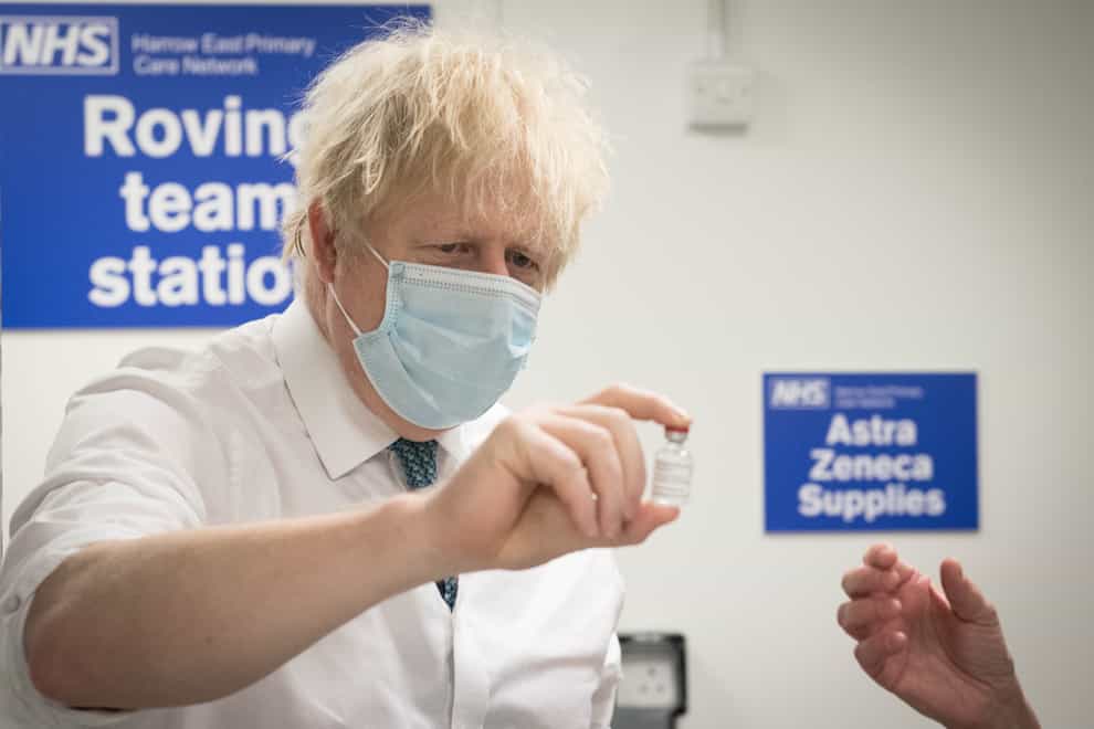 Prime Minister Boris Johnson sees how a dose of the Oxford/Astra Zeneca Covid 19 vaccine is prepared for a mobile vaccination centre at Barnet FC’s ground at The Hive, north London