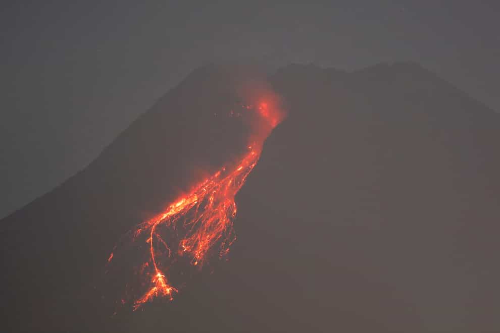 Hot lava runs down the side of Mount Merapi