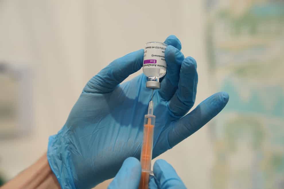 A member of staff prepares a dose of the Oxford/Astrazeneca coronavirus vaccine