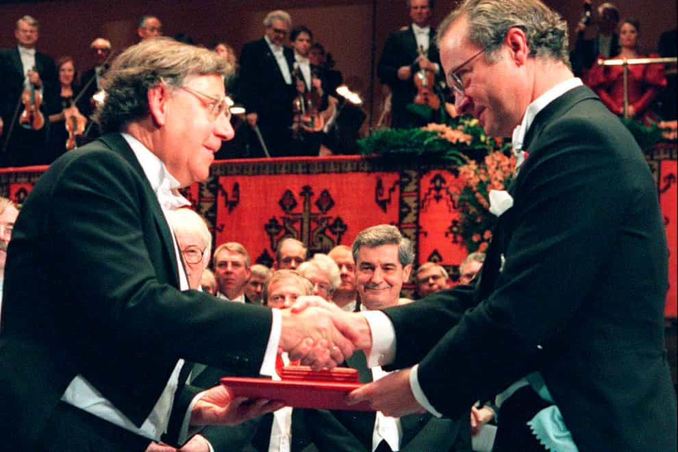 Dutch Professor Paul J Crutzen, left, receiving the Nobel Prize for chemistry from Swedish King Carl XVI Gustaf at the Concert Hall in Stockholm, Sweden, in 1995