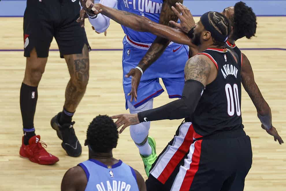 Houston Rockets guard John Wall shoots during the third quarter against the Portland Trail Blazers