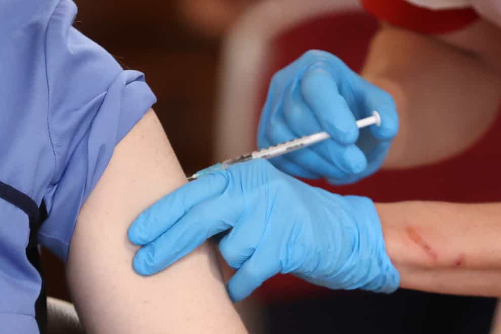 Care home staff receive the Pfizer/BioNtech covid-19 vaccine at Bradley Manor residential care home in Belfast (Liam McBurney/PA)