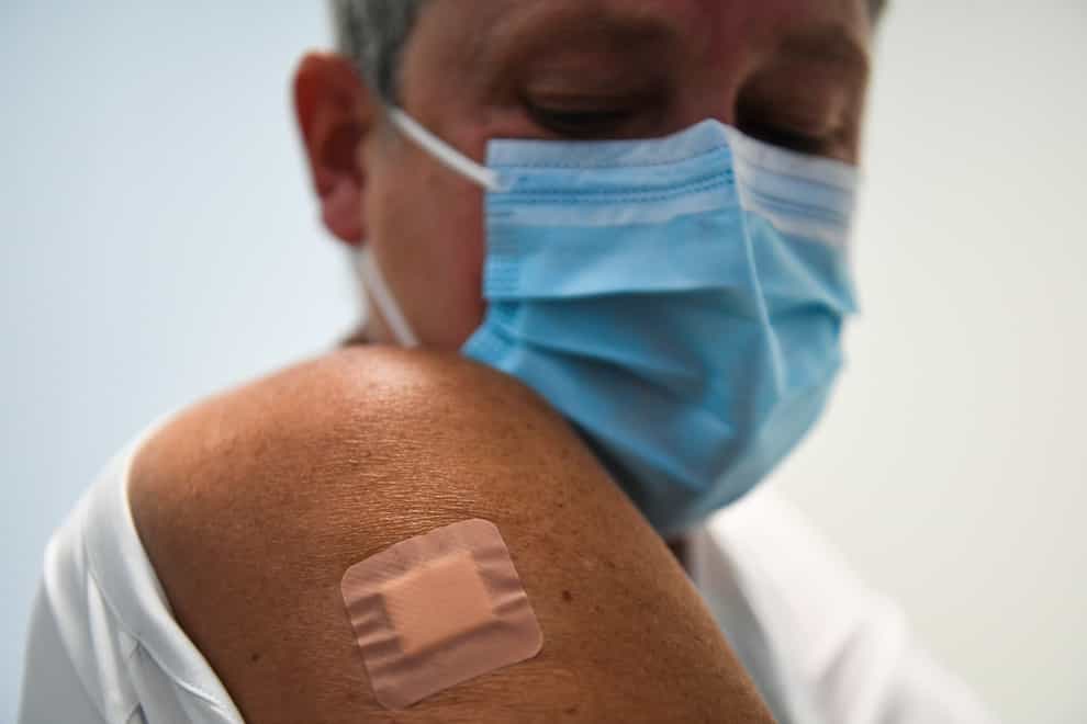 A plaster applied to the site of a jab on someone's arm