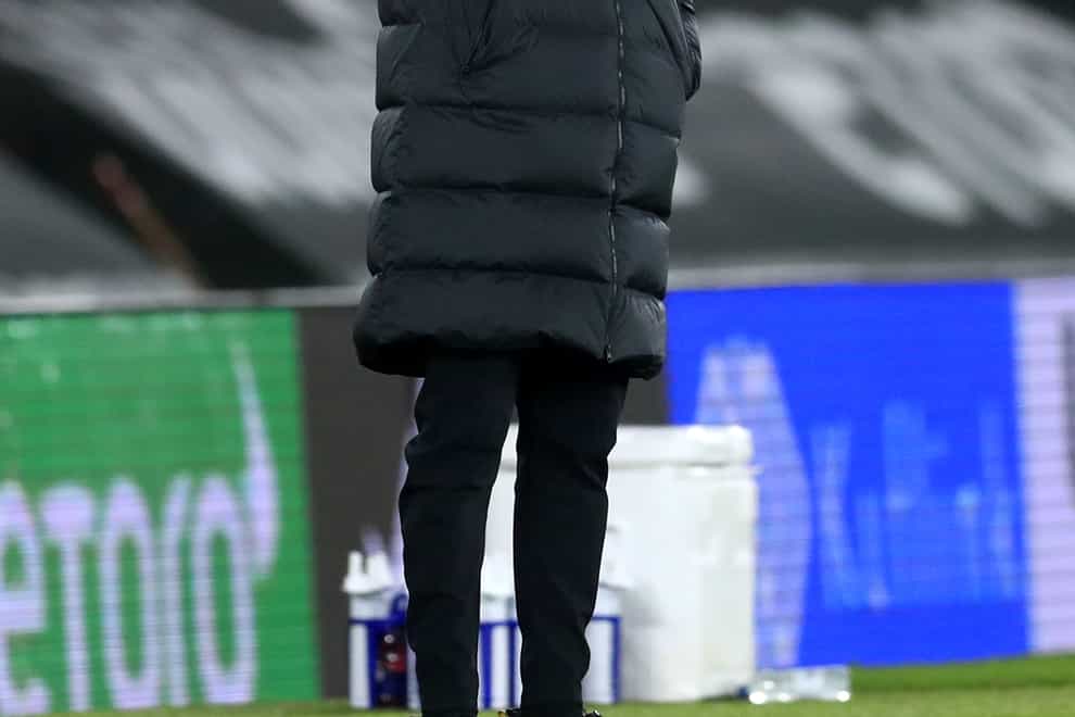 Liverpool manager Jurgen Klopp covers his face in exasperation