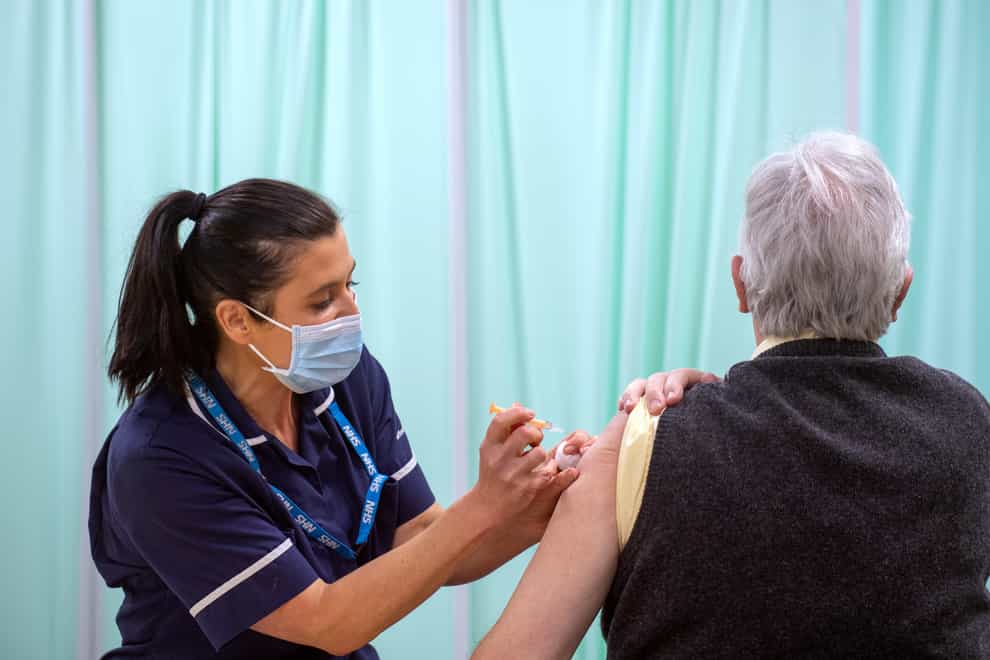 A patient receives a coronavirus vaccine