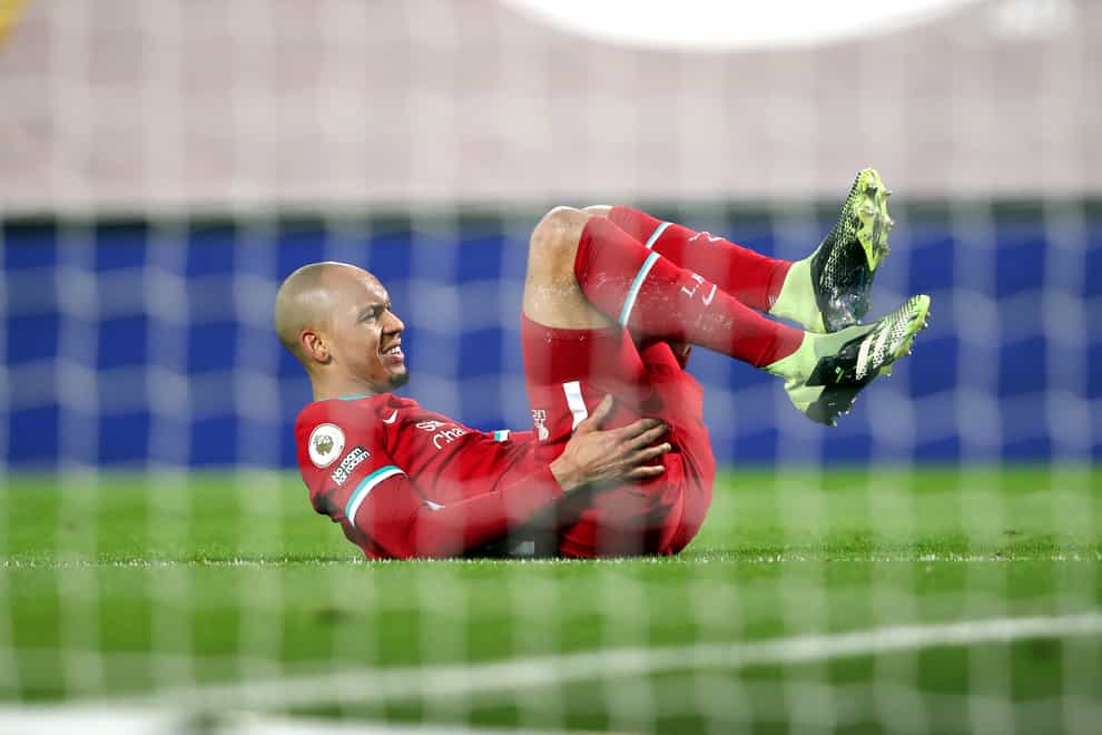 Liverpool midfielder Fabinho goes down holding his hamstring